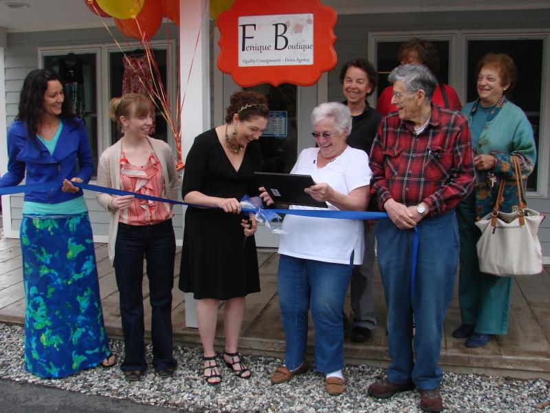 Front row, from left, Wiscasset Area Chamber of Commerce Board Vice Chairman Sherri Dunbar, Wiscasset Town Planner Misty Parker, boutique owner Tanya Pomerleau, and selectmen Judy Colby and William Curtis share a laugh during last week's ribbon-cutting; back row, from left, chamber board members Pamela Brackett, Monique McRae and Pat Stauble. SUSAN JOHNS/Wiscasset Newspaper