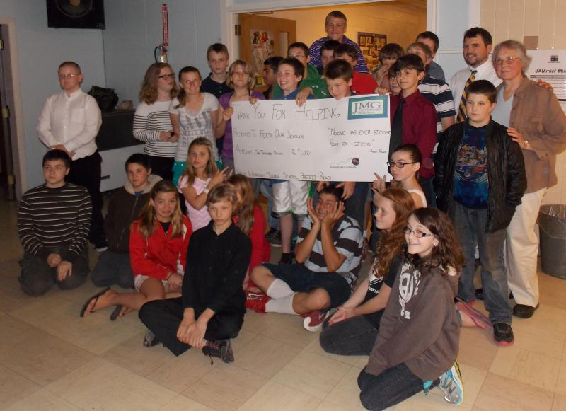 Project Reach students select the Feed Our Scholars program to receive the $1,000 donation from the Unity Foundation. Courtesy of Wiscasset Middle School