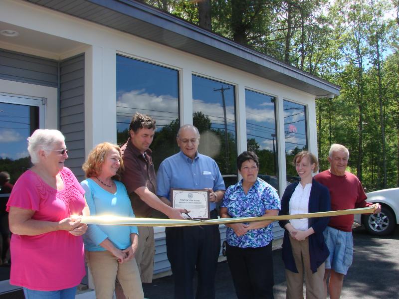 Taking part in a ribbon-cutting for Trucks II are, from left, Wiscasset Selectman Judy Colby, Norm's Used Cars vice president Beverly Needham, Norm's Used Cars and Trucks II owner Norman Sherman, selectmen Ed Polewarczyk and Pam Dunning, Town Planner Misty Parker, and Planning Board member Ray Soule. SUSAN JOHNS/Wiscasset Newspaper