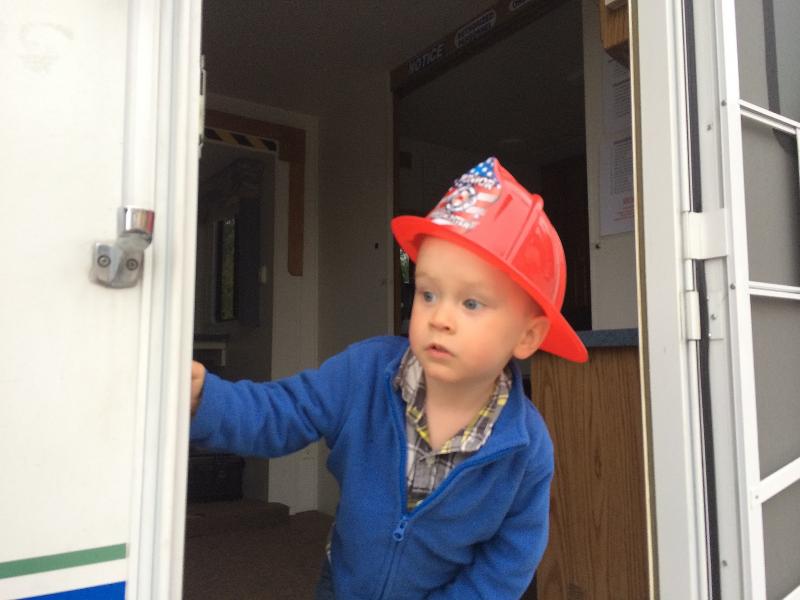 Lincoln Vannah, 2, of Dresden, looks out from Lincoln County Emergency Management Agency’s incident command trailer at the Dresden Fire Department’s open house on Oct. 1. SUSAN JOHNS/Wiscasset Newspaper Lincoln Vannah