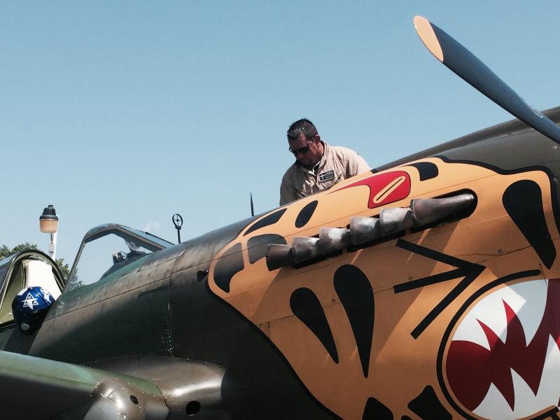 Texas Flying Legends pilot Bernie Vasquez tends a P40 fighter plane at Wiscasset Municipal Airport on July 28. SUSAN JOHNS/Wiscasset Newspaper Texas Flying Legends
