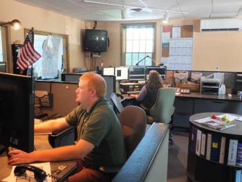 The Lincoln County Emergency Management Agency has offered to be the first in Maine to try following a new set of dispatch protocols for fire and law related emergencies. Below, Teresa Grenier demonstrates how the Emergency Medical Dispatch protocol software operates. She said she hopes new protocol software for fire and law-related emergencies will “speak” with the Computer Aided Dispatch software used by Lincoln County Communications that automatically records information that's typed in. JOHN MAGUIRE/Wiscasset Newspaper Emergency dispatch officers at Lincoln County Communications follow an established set of questions, 911 Emergency Medical Dispatch protocols, for each emergency that arises, from calls about heart attacks to construction accidents. Operators may also soon see a new set of protocols for fire and law related emergencies and Lincoln County EMA has offered to be the first in Maine to try them out. JOHN MAGUIRE/Wiscasset Newspaper