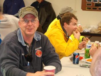 Edgecomb Fire Chief Roy Potter, left, and fellow emergency personnel from thoughout Lincoln County and elsewhere fuel up at the 911 Center in Wiscasset before the disaster drill. SUSAN JOHNS/Wiscasset Newspaper