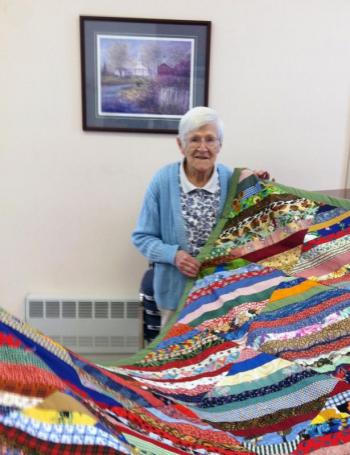 Ruth Applin, a member of the Ladies Organ Society for 80 years, displays a quilt she recently made. At the age of 95, Applin is still very active in the group, and attends their weekly meetings on Wednesdays. CHARLOTTE BOYNTON/Wiscasset Newspaper