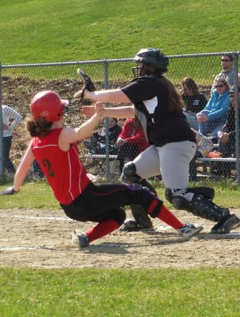Briana Goud slides safely into home in Wiscasset’s season opener in Lisbon on April 19. KATHY ONORATO/Wiscasset Newspaper