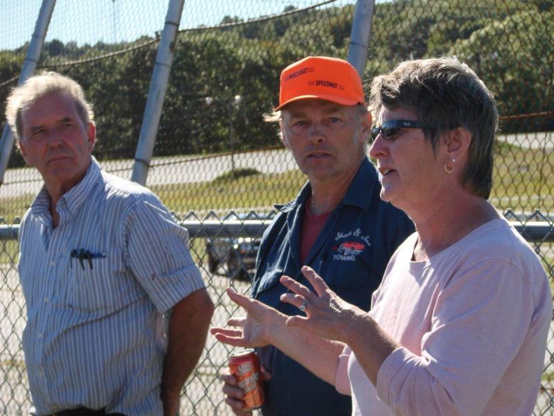 Owner RIchard Jordan, left, and race car driver Dale Chadbourne of Woolwich listen as Vanessa Jordan speaks with drivers and other volunteers about plans for an October race. SUSAN JOHNS/Wiscasset Newspaper Owner RIchard Jordan, left, and race car driver Dale Chadbourne of Woolwich listen as Vanessa Jordan speaks with drivers and other volunteers about plans for an October race. SUSAN JOHNS/Wiscasset Newspaper
