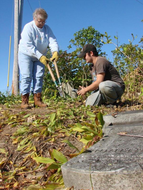 Gail McKinney, left, of Skowhegan and Mike Miete of Dresden help clean up around old grave stones. SUSAN JOHNS/Wiscasset Newspaper Gail McKinney, left, of Skowhegan and Mike Miete of Dresden help clean up around old grave stones. SUSAN JOHNS/Wiscasset Newspaper