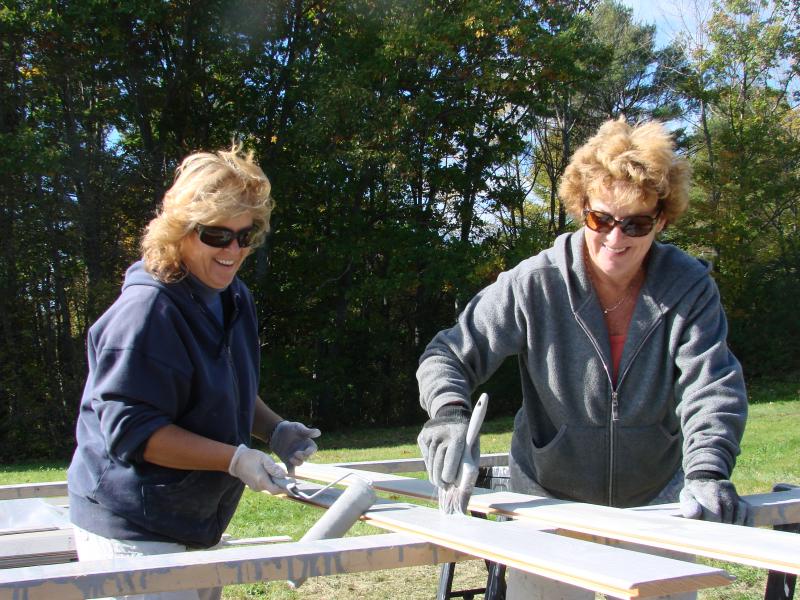 Wendy Caron, left, of Boothbay Harbor and Michelle Peele have fun working at the site of a riverside barn, at Peele's Marianmade Farm in Wiscasset. SUSAN JOHNS/Wiscasset Newspaper Wendy Caron, left, of Boothbay Harbor and Michelle Peele have fun working at the site of a riverside barn, at Peele's Marianmade Farm in Wiscasset. SUSAN JOHNS/Wiscasset Newspaper