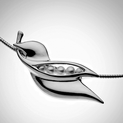 This 14k gold pendent of a dove holding a peapod in his mouth is a sample of the jewelry designed by Lugosch. Courtesy of Peapod Jewelry This 14k gold pendent of a dove holding a peapod in his mouth is a sample of the jewelry designed by Lugosch. Courtesy of Peapod Jewelry