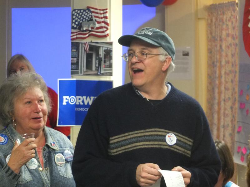 Mick Devin announces the first round of results at Lincoln Country Democrat headquarters in Damariscotta November 6. Below: Bruce MacDonald outside the Lincoln Country Democrat headquarters in Damariscotta. MacDonald continually checked for updates throughout the night. RYAN LEIGHTON/Boothbay Register Mick Devin announces the first round of results at Lincoln Country Democrat headquarters in Damariscotta November 6.