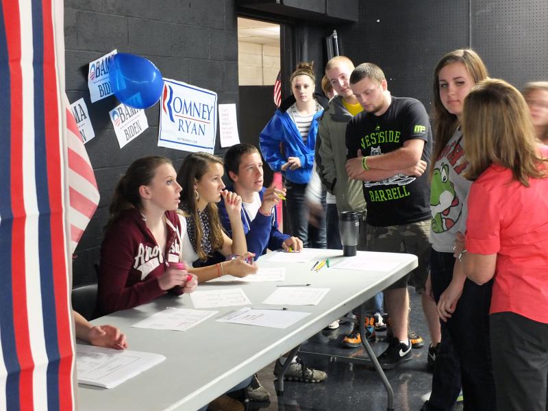 Student Council members, seated left to right, Megan Corson, Sarah Hanley and Zach Ellison, check in student voters at Wiscasset High School’s mock election on October 30. Below: Annalise Haase and Nick Brackley cast their ballots. Ballot Clerks are Maddly Wehrle and Ryan Hanley. KATHY ONORATO/Wiscasset Newspaper