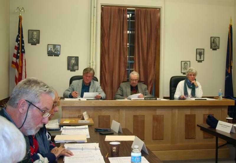 Lincoln County Budget Commissioners answer questions from budget committee members at a meeting November 8 discussing budget items. Left to right, commissioners Sheridan Bond, William Blodgett and Lynn Gilley Martin. Below, Kenneth Mason of the Lincoln County Sheriff’s Department combs over his department’s budget line item by line, and newly-elected Hamilton Meserve observes the process of the meeting. CHARLOTTE BOYNTON/Wiscasset Newspaper Lincoln County Budget Commissioners answer questions from budget committee members at a meeting November 8 discussing budget items. Left to right, commissioners Sheridan Bond, William Blodgett and Lynn Gilley Martin. CHARLOTTE BOYNTON/Wiscasset Newspaper