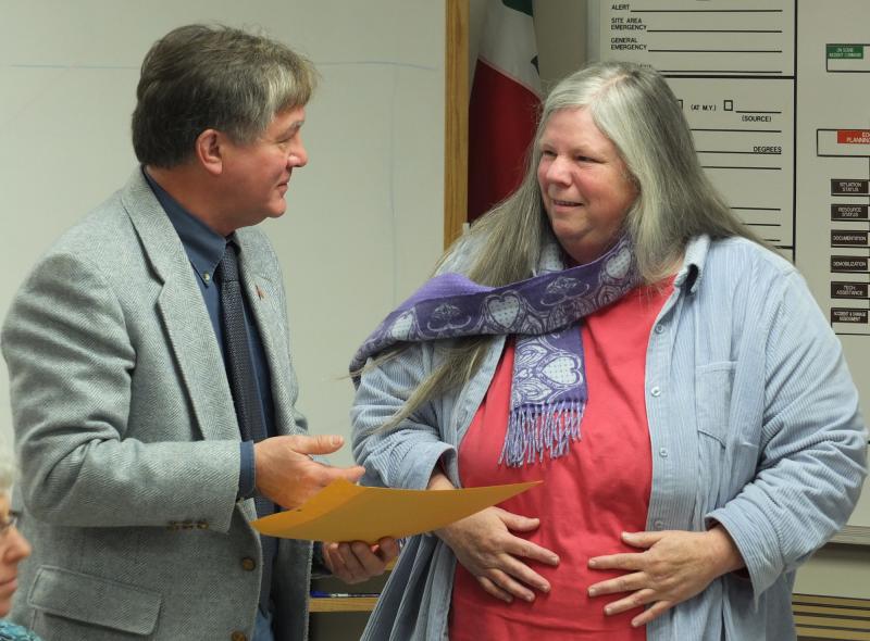 Lincoln County TV Director Mary Ellen Crowley accepted the Spirit of America award presented to her by Commissioner Sheridan Bond Lincoln County TV Director Mary Ellen Crowley accepted the Spirit of America award presented to her by Commissioner Sheridan Bond