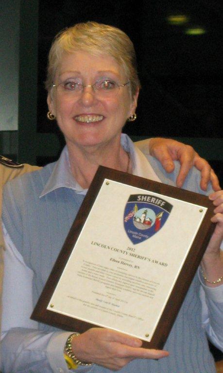 Eileen Harvey displays the special award she received from the Sheriff's Office. Courtesy of the Lincoln County Sheriff's Office Eileen Harvey displays the special award she received from the Sheriff's Office. Courtesy of the Lincoln County Sheriff's Office