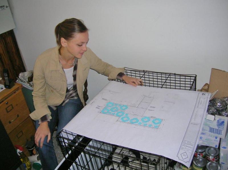 Clubhouse manager Ally Melchreit looks over seating plans for the new deck. JOE GELARDEN/Boothbay Register Clubhouse manager Ally Melchreit looks over seating plans for the new deck. JOE GELARDEN/Boothbay Register