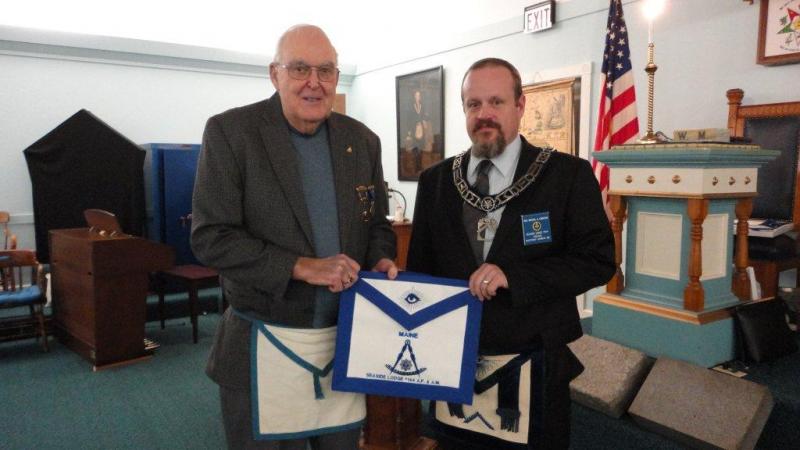 Merlin H. Gray, left, is presented his Life Member apron by Worshipful Mike Leighton. Below: Newest Master Mason Zachary Robert Barry and Lifetime Member Curtis W. West. Courtesy of Gary Tilton