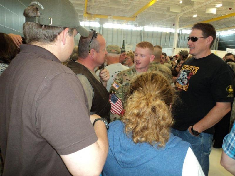 Pvt. Mason Leighton talks with his father, Micheal Leighton, and family friend, Patrick Higgins. Courtesy of Isaac Luken Pvt. Mason Leighton talks with his father, Micheal Leighton, and family friend, Patrick Higgins. Courtesy of Isaac Luken