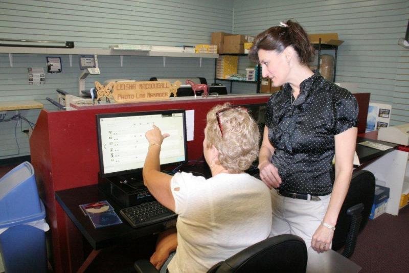 Leisha MacDougall assists Peggy Pinkham at one of the new kiosks at Video Loft. KEVIN BURNHAM/Boothbay Register Leisha MacDougall assists Peggy Pinkham at one of the new kiosks at Video Loft. KEVIN BURNHAM/Boothbay Register