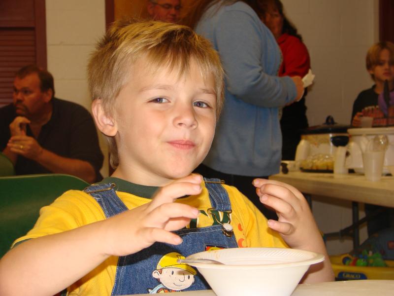 Mason Higgins, 4, of Wiscasset, son of Wiscasset Ambulance Service employees Katie and Steve Higgins, enjoys some chili at a cookoff the Wiscasset Ambulance Attendants Association held September 21. SUSAN JOHNS/Wiscasset Newspaper