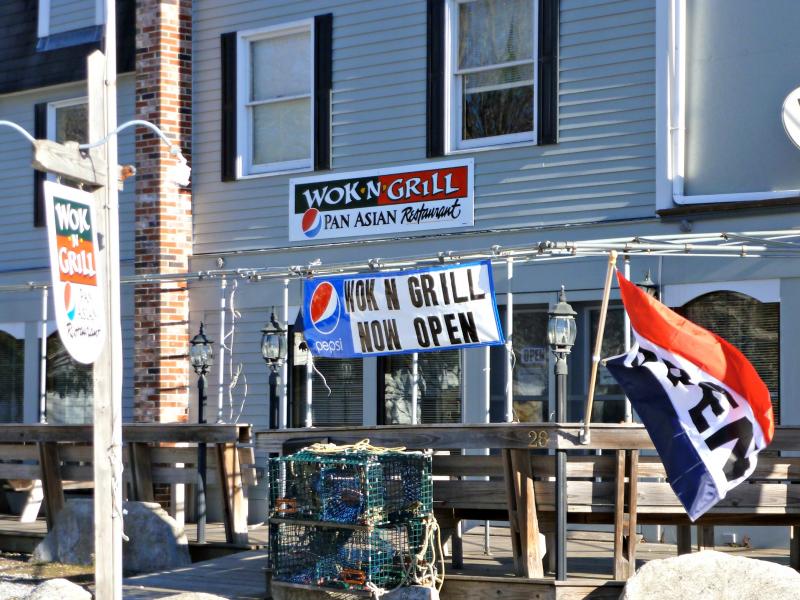 The open flag waves invitingly in front of the new Wok ‘n Grill at 28 Union Street in Boothbay Harbor. KATRINA CLARK/Boothbay Register