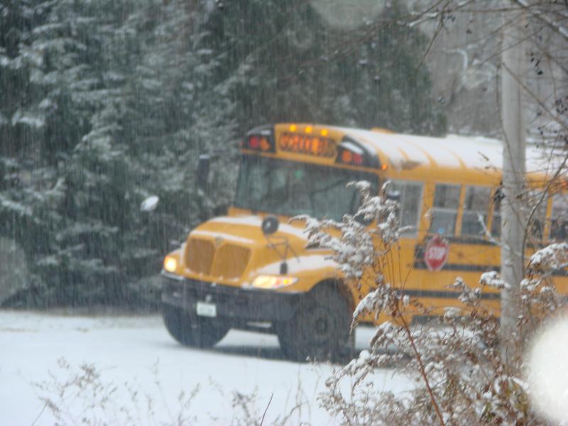 This RSU 12 school bus was waiting for Head Tide Hill in Alna to be treated before its driver took it the rest of the way up the hill during Tuesday’s snowy morning commute. SUSAN JOHNS/Wiscasset Newspaper bus on Alna hill waiting for sand