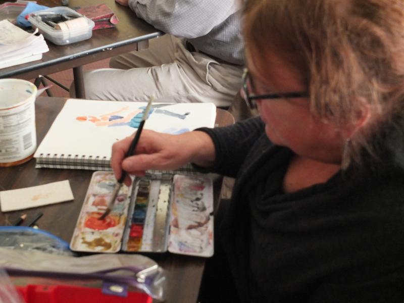 Jane Rosenfield experiments with watercolors at a recent life drawing class at Boothbay Region Art Foundation. LISA KRISTOFF/Boothbay Register