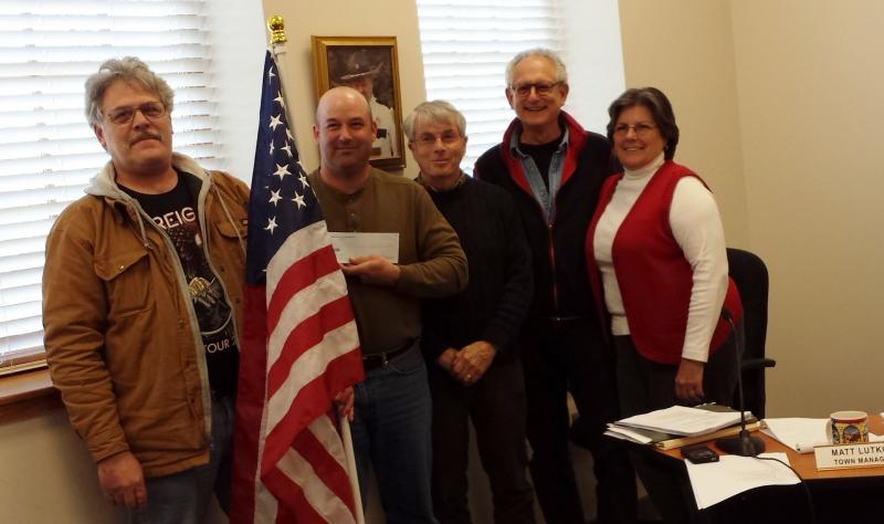 From left, Richard McFarland, Selectmen’s Chairman Joshua Pinkham, and selectmen David Atwater, Ronn Orenstein and Robin Mayer. The Damariscotta Board of Selectmen was recently presented with a $1,000 check for insurance from the American Legion to be able to hang American flags throughout downtown during the summer. BEN BULKELEY/Wiscasset Newspaper