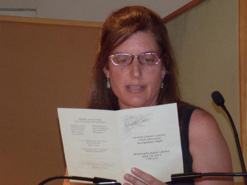 College Transitions instructor, Elizabeth Potter reads Emily Dickinson’s poem “Success is Counted Sweetest” followed by excerpts from a student’s literary essay on the poem. Courtesy of Bonnie Merrill