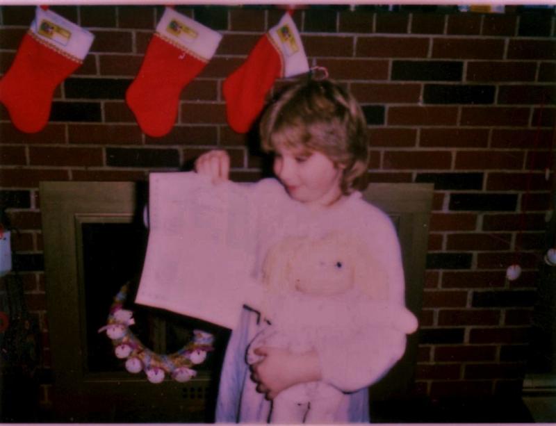 Melinda Nunan, now Melinda Fuller, holds up the adoption paper for her Cabbage Patch Doll at a 1980s Nunan family Christmas at what is now the Wiscasset Newspaper office, on Wiscasset’s Gardiner Road. Courtesy of Melinda Fuller Melinda Nunan, Melinda Fuller, Wiscasset Newspaper office