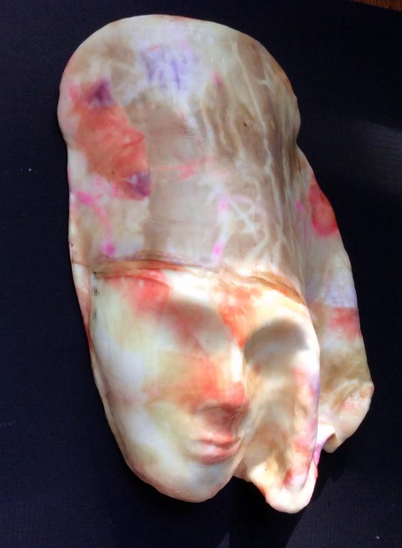 Encaustic mask by Diane Green-Hebert on display in the show, In the Mirror of Its Tide: Waxworks on the River at the Damariscotta River Grill. Courtesy of Kim Traina Encaustic mask by Diane Green-Hebert