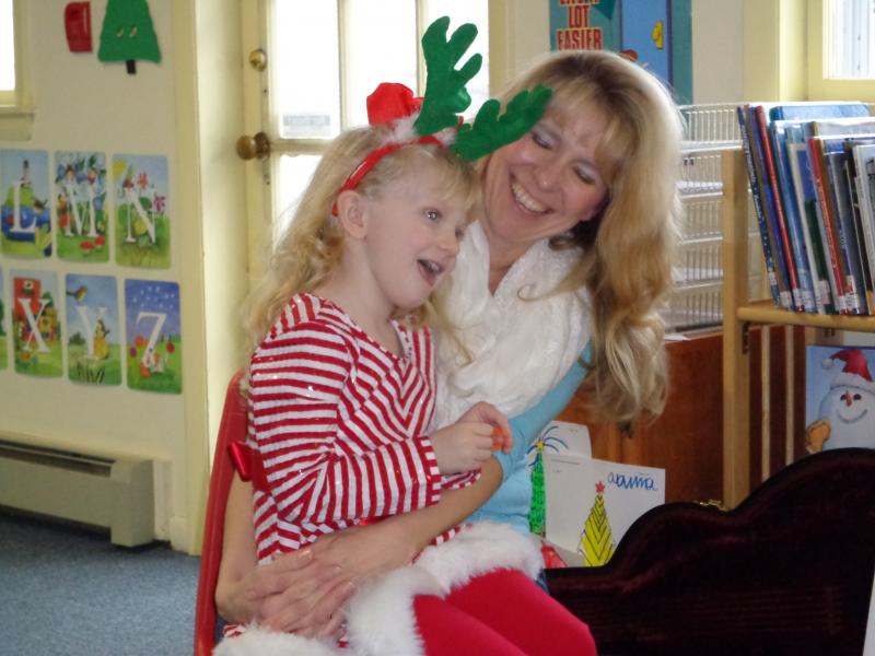 Devon Roy and her mom sing "Frosty the Snowman" with Mat O’Donnell’s guitar accompaniment. Courtesy of Natalie Castonia