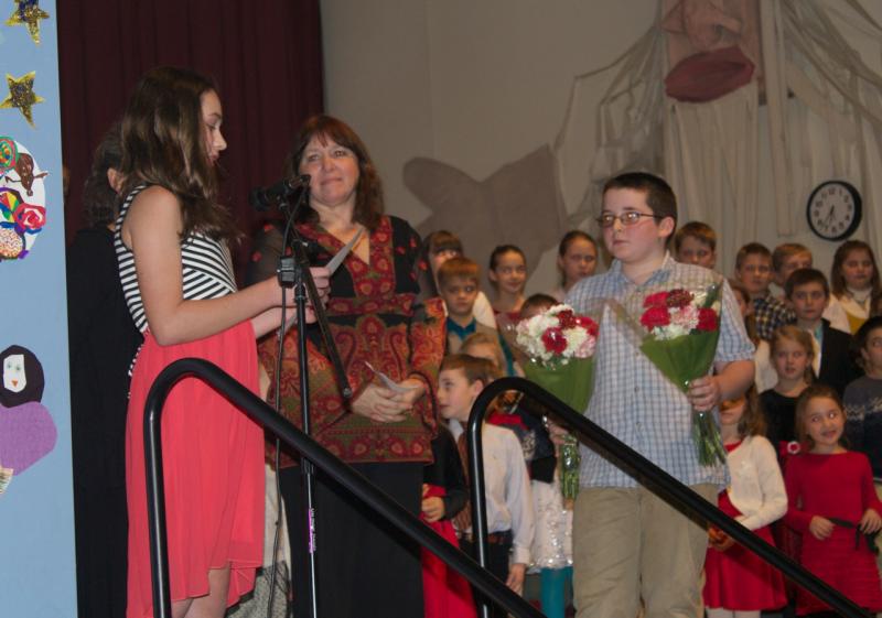Sixth graders Meghan Clifford and Ryan Potter present flowers to Mrs. Robin MacCready, Integrated Studies teacher, and Ms. McIvor (not in view) for putting together another wonderful program. Courtesy of Lisa Clarke