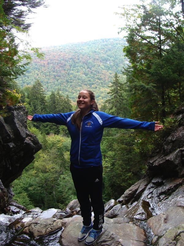 Freshman Summer Chamberlin standing tall on top of Angel Falls. Courtesy of Chip Schwehm