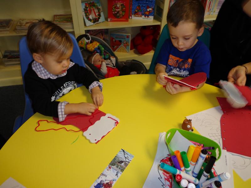 Gabriel Bonilla and Mason Michaud are busy sewing their library stocking. Courtesy of Natalie Castonia