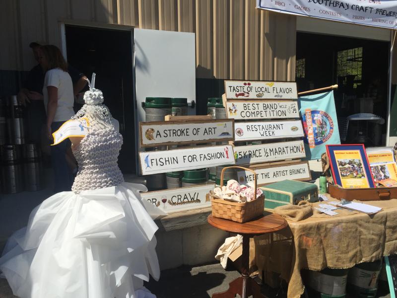 A display showcasing the highlights of Harbor Fest was set up outside the Watershed Tavern during the Declaration of Fermentation. KATRINA CLARK/Boothbay Register
