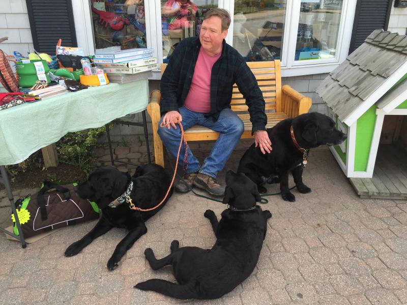 Don Kingsbury of Two Salty Dogs with three of his black labs. KATRINA CLARK/Boothbay Register
