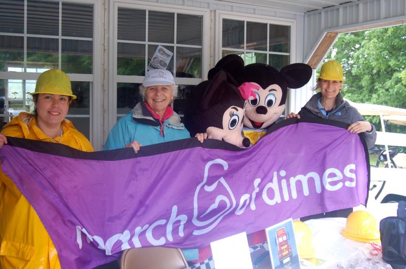 Micky and Minnie take shelter with representatives of the March of Dimes at the Touch-a-Truck event. From left are Aubrey Martin, Sally Hennessey and Hildy Ginsberg. ART MAYERS/Wiscasset Newspaper