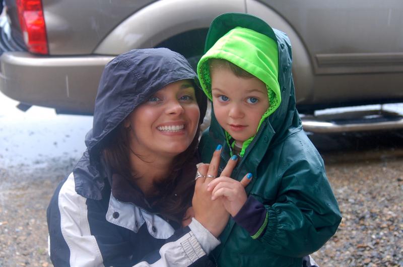 Celeste and Gavin Lincoln of Richmond battle wind and rain to attend Touch-a-Truck event at the Wiscasset Speedway on Sunday, June 28. ART MAYERS/Wiscasset Newspaper