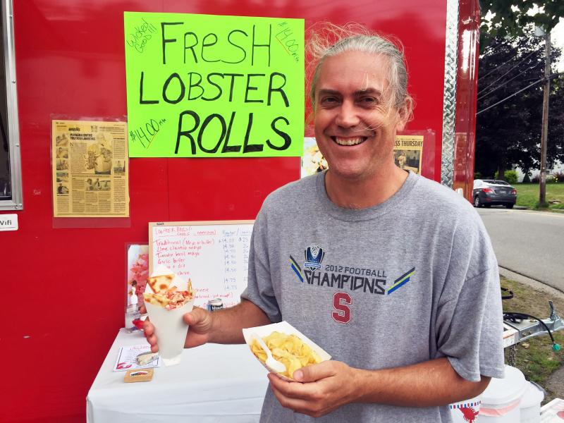 Jim Morris, from San Fransisco, comes to visit his in-laws each summer, and makes a point of stopping at Joe Lane’s for lobster. On July 15 he was having a lobster “cone.” SUZI THAYER/Wiscasset Newspaper