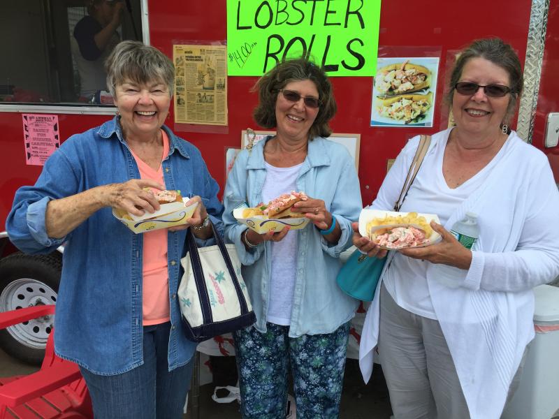 Barbara Flewelling, of Pemaquid, left, Debbie Pelletier, from Clinton Connecticut, and Cheryl Pelletier, from Blue Hill, all came to Damariscotta for one of Joe Lane’s lobster rolls. SUZI THAYER/Wiscasset Newspaper