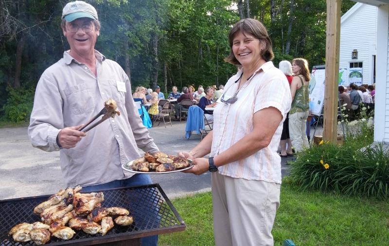 SVCA board member John Wentzel and Programs Manager Lynne Flaccus serve up organic chicken from Tide Mill Organic Farm in Maine and sausage from Morning Dew Farm in Newcastle at SVCA’s sustainable barbecue last week. Courtesy of Kristin Pennock