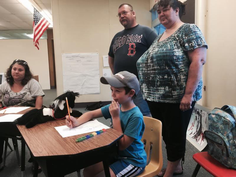 Troy Giroux and Ericka Peak of Wiscasset look on as their son Hunter Giroux, 6, takes part in a math class in the Wiscasset School Department’s summer session on Aug. 6. SUSAN JOHNS/Wiscasset Newspaper Troy Giroux, Ericka Peak, Hunter Giroux
