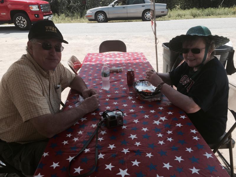 Joe and Kathy Devonshire of Jefferson eat before riding the rails Aug. 9 on day two of a picnic at Wiscasset, Waterville & Farmington Railway Museum in Alna. SUSAN JOHNS/Wiscasset Newspaper Joe Devonshire, Kathy Devonshire