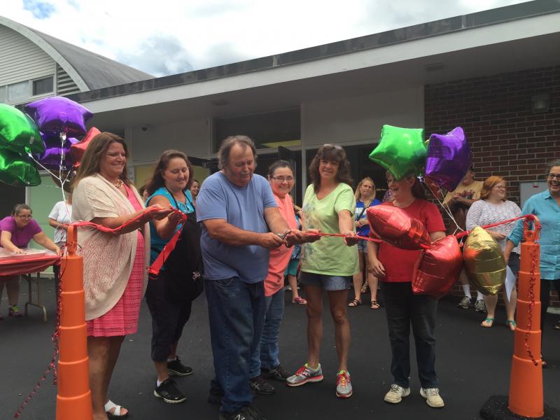 Full circle: One-time kindergarteners at what is once again an elementary school cut the ribbon on Wiscasset Elementary School on Aug. 27. From left are Cindy Collamore, Theresa Meehan, Tim Delano, Lori Munson, Paula Foye and Lynn Lincoln. All now work for the Wiscasset School Department, Foye, as a bus driver; the others in various positions at the elementary school. SUSAN JOHNS/Wiscasset Newspaper Cindy Collamore, Theresa Meehan, Tim Delano, Lori Munson, Paua Foye, Wiscasset Elementary School, ribbon-cutting