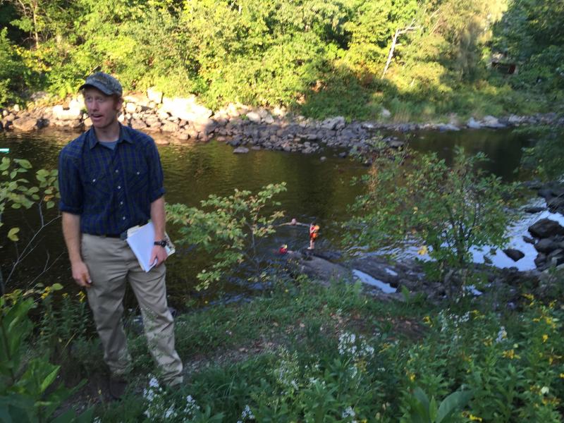 Nick Nelson of the engineering and design firm Inter-Fluve meets with Alna’s Head Tide Dam Committee Sept. 9 as swimmers enjoy an evening on the Sheepscot River below. SUSAN JOHNS/Wiscasset Newspaper Nick Nelson, Inter-Fluve, Head Tide Dam