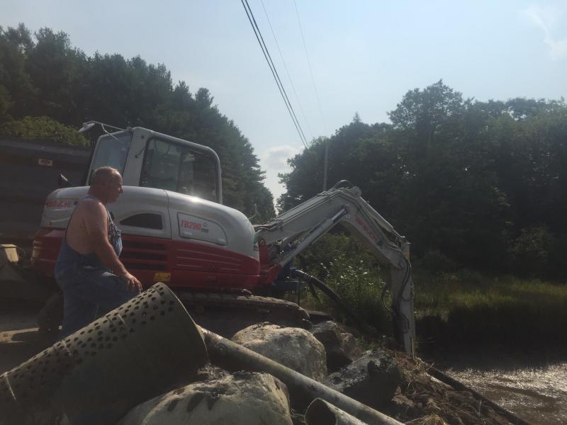 Stephen Zuppa, president of Wiscasset, Waterville & Farmington Railway Museum in Alna, looks down on work under way Sept. 3 to replace a fire hydrant on Cross Road. SUSAN JOHNS/Wiscasset Newspaper Wiscasset, Waterville & Farmington Railway Museum, Stephen Zuppa