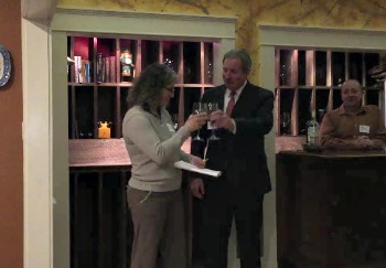 A toast to the partnership by Ellen McFarland, president of the Lincoln County Animal Shelter board, left, with Tony McDonald, president of the Coastal Humane Society board. KATRINA CLARK/Boothbay Register