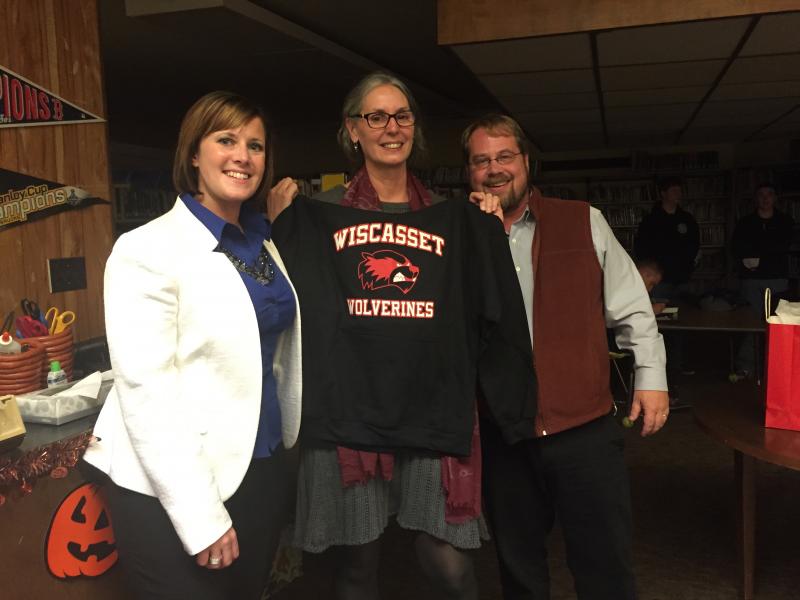 Wiscasset Superintendent of Schools Heather Wilmot, Wiscasset Middle High School Principal Peg Armstrong, and School Committee Chairman Steve Smith take part in a presentation of a welcome gift to Armstrong. SUSAN JOHNS/Wiscasset Newspaper Heather Willmot, Peg Armstrong, Steve Smith
