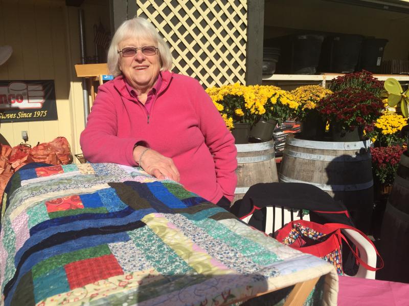 Westport Island’s Cyndy Lewis helps man a table outside Ames Supply in Wiscasset Oct. 24 to sell tickets on a quilt to raise money for the American Cancer Society. SUSAN JOHNS/Wiscasset Newspaper Cyndy Lewis