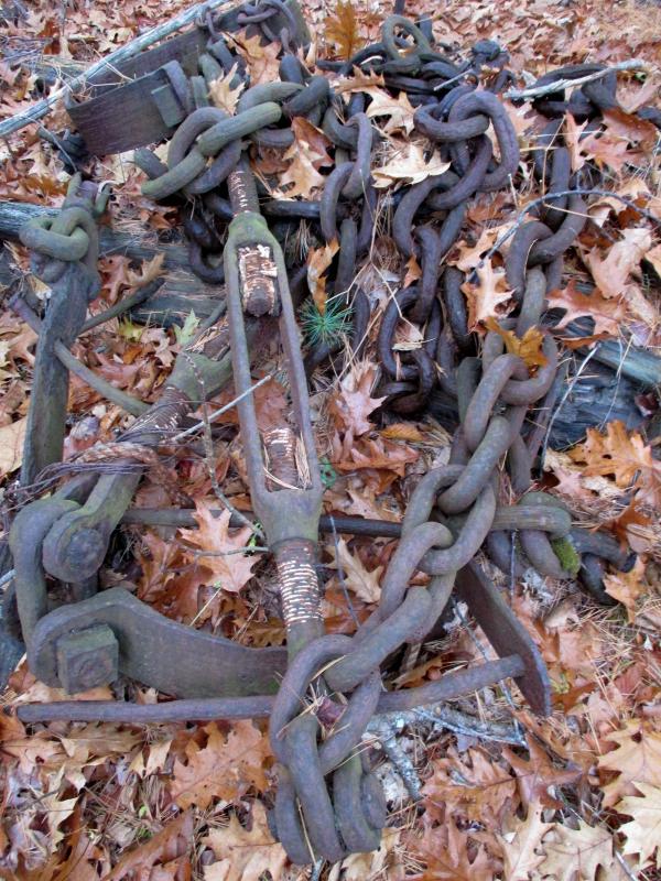 A length of chain and turnbuckle lies amid a pile of odds and ends salvaged from the former Hesper and Luther Little, the old schooners that for decades remained on the Wiscasset waterfront. PHIL DI VECE/Wiscasset Newspaper